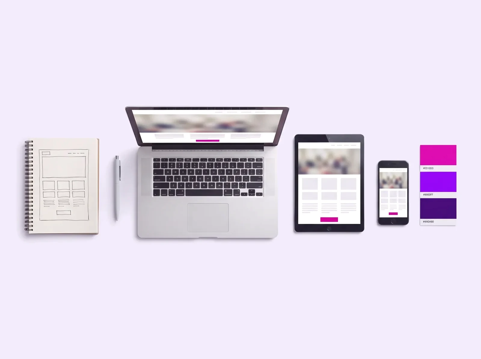 Notebook, tablet e celular exibindo um site responsivo, com caderno de wireframes e paleta de cores